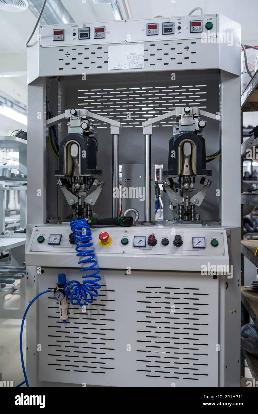 professional automatic machinery equipment at shoe factory Stock Photo ...