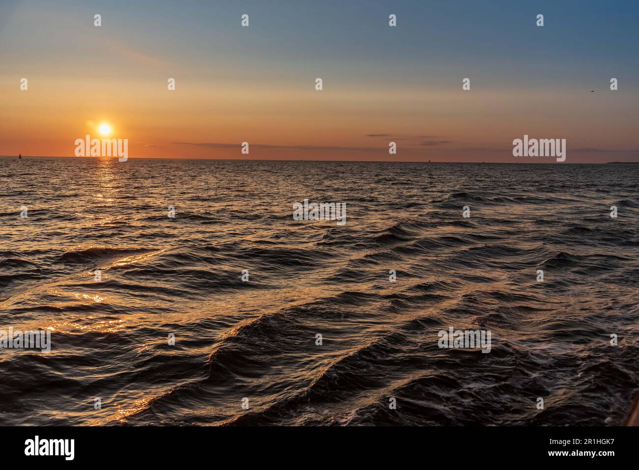 Sunset across the waves. Stock Photo