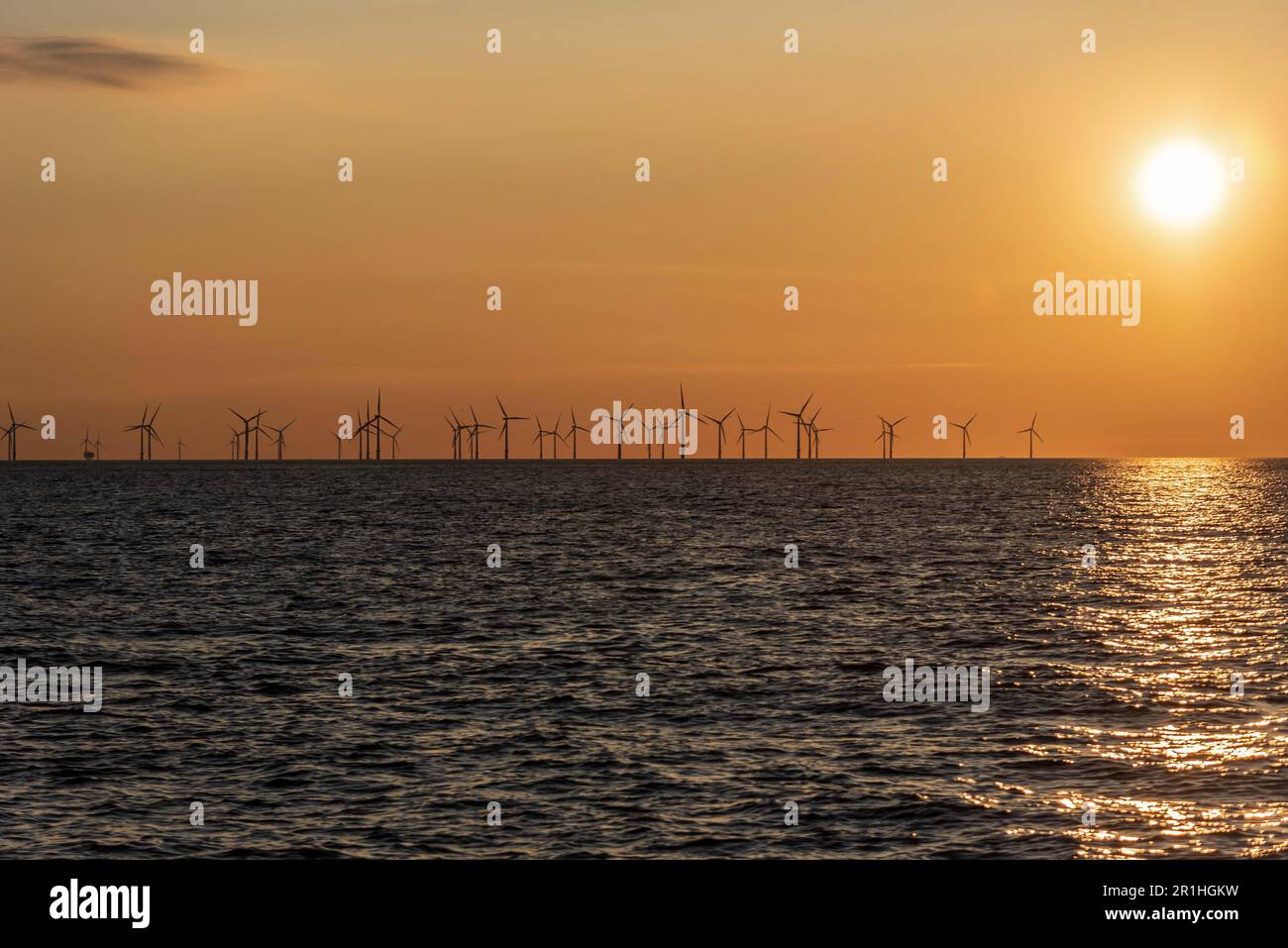 Sunset across the waves. Stock Photo