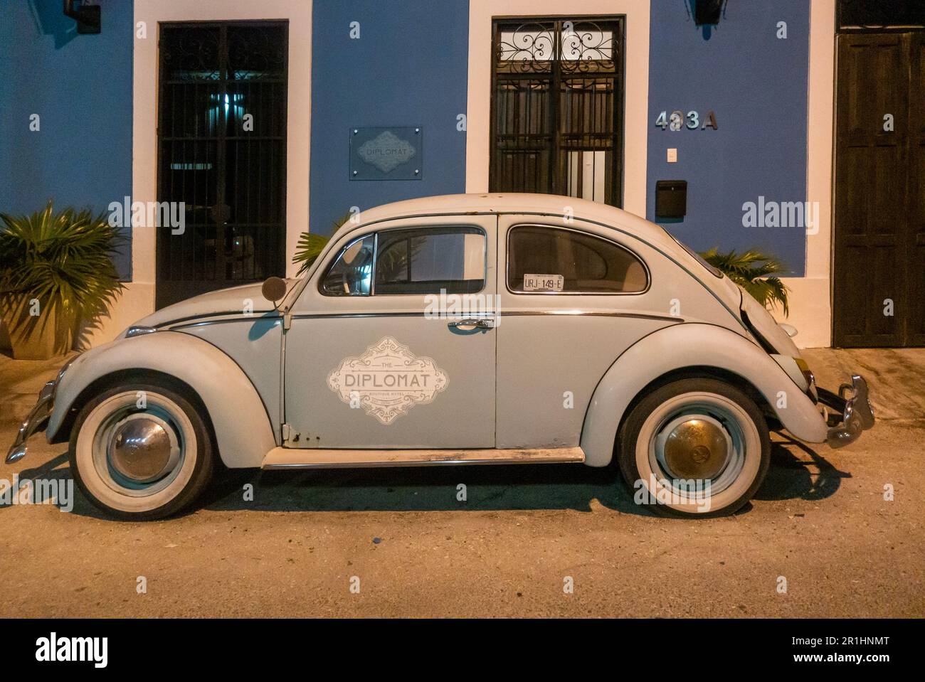 restored old VW beetle in front of the Diplomat Boutique hotel in Santiago  district in Merida Yucatan Mexico Stock Photo