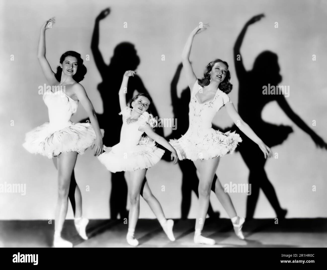 CYD CHARISSE, MARGARET O'BRIEN and KARIN BOOTH in THE UNFINISHED DANCE (1947), directed by HENRY KOSTER. Credit: M.G.M. / Album Stock Photo