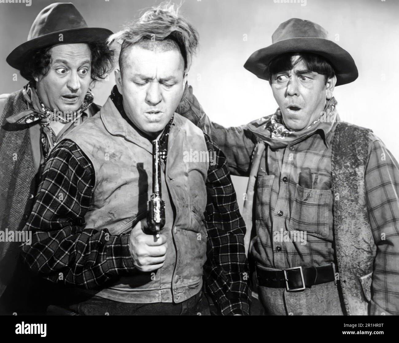 MOE HOWARD, LARRY FINE, CURLY HOWARD and THE THREE STOOGES in THE THREE TROUBLEDOERS (1946), directed by EDWARD BERNDS. Credit: COLUMBIA PICTURES / Album Stock Photo
