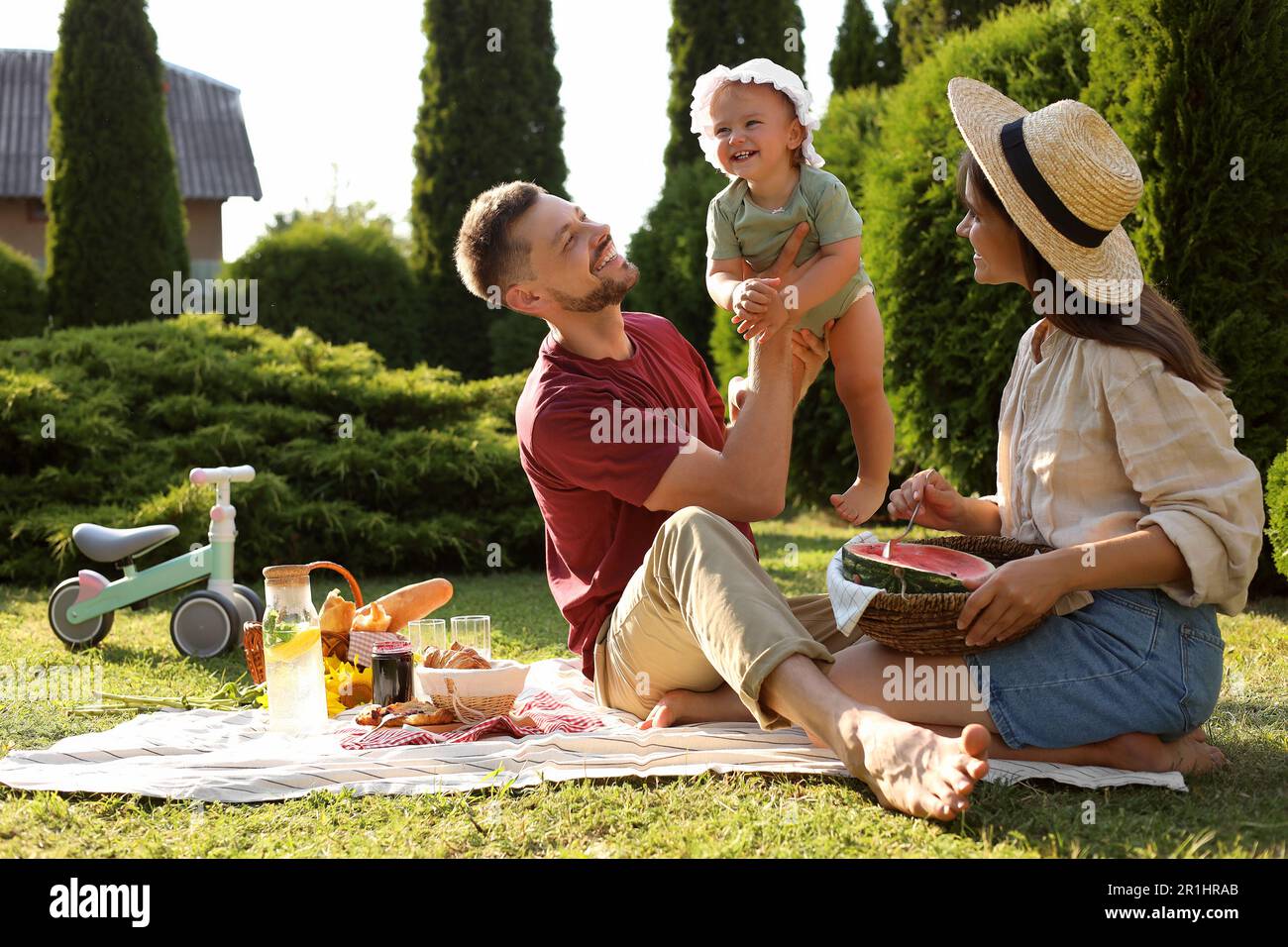 Happy family having picnic in garden on sunny day Stock Photo - Alamy