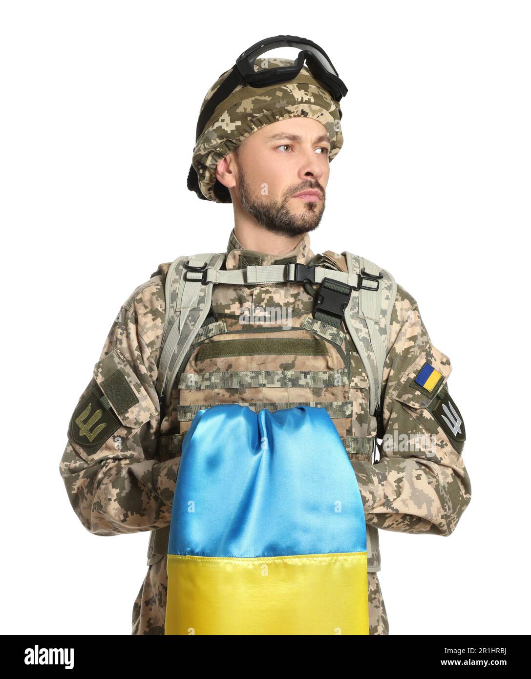Soldier in military uniform with Ukrainian flag on white background ...