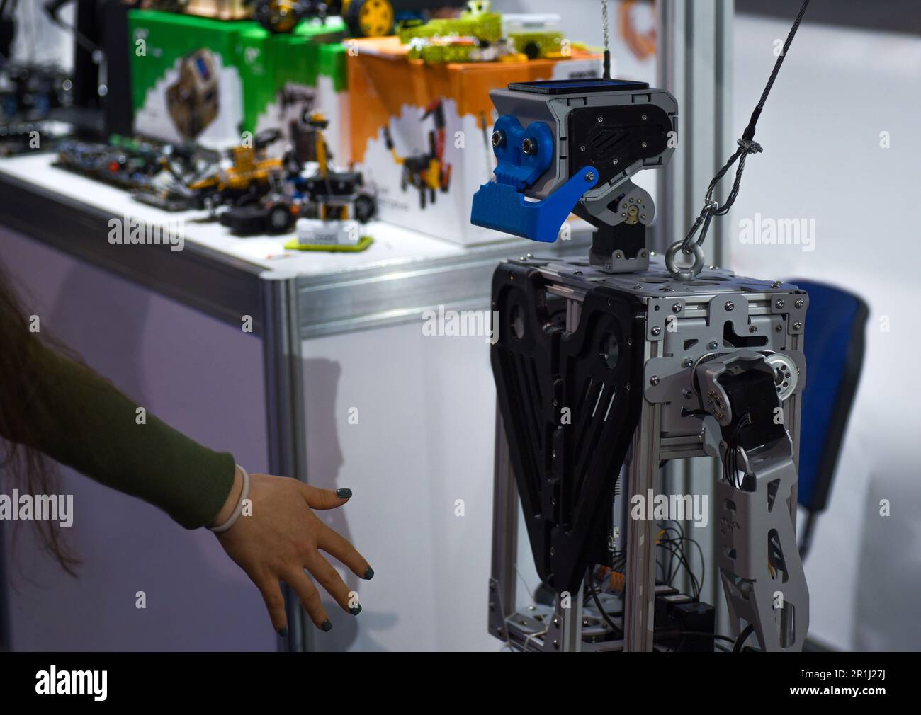 Man shaking hands with a robot Stock Photo
