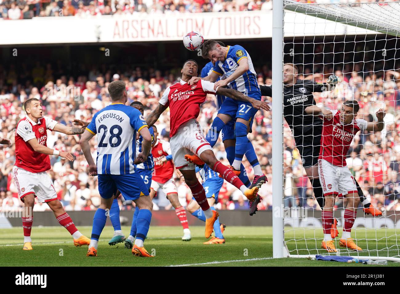 Brighton and Hove Albion’s Billy Gilmour heads away from Arsenal’s Gabriel during the Premier League match at the Emirates Stadium, London. Picture date: Sunday May 14, 2023. Stock Photo