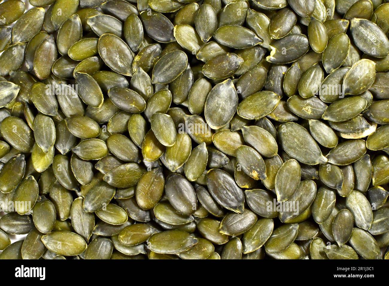 Close up view of pumpkin seeds. Backgrounds. Stock Photo