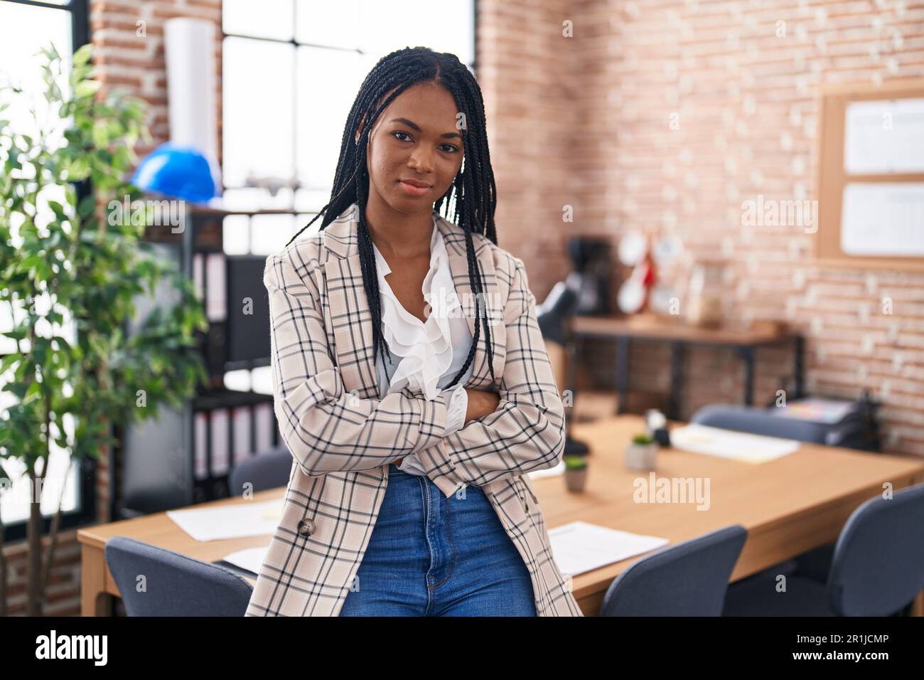 African american woman business worker standing with arms crossed ...