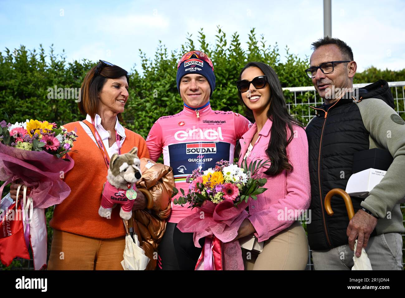 Cesena, Italy. 14th May, 2023. Belgian Remco Evenepoel of Soudal Quick-Step wearing the pink jersey (maglia rosa) of leader in the overall ranking celebrates with his mother Agna Van Eeckhout (L), his father Patrick (R) and his wife Oumaima Oumi Rayane (2nd R) after the stage nine of the 2023 Giro D'Italia cycling race, an individual time trial from Savignano sul Rubicone to Cesena (35km), in Italy, Sunday 14 May 2023. The 2023 Giro takes place from 06 to 28 May 2023. BELGA PHOTO JASPER JACOBS Credit: Belga News Agency/Alamy Live News Stock Photo