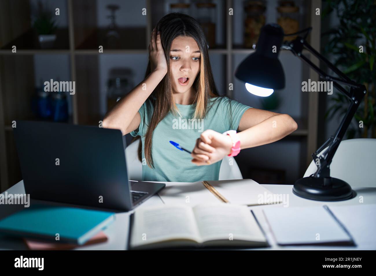 Teenager checking the time school hi-res stock photography and images ...