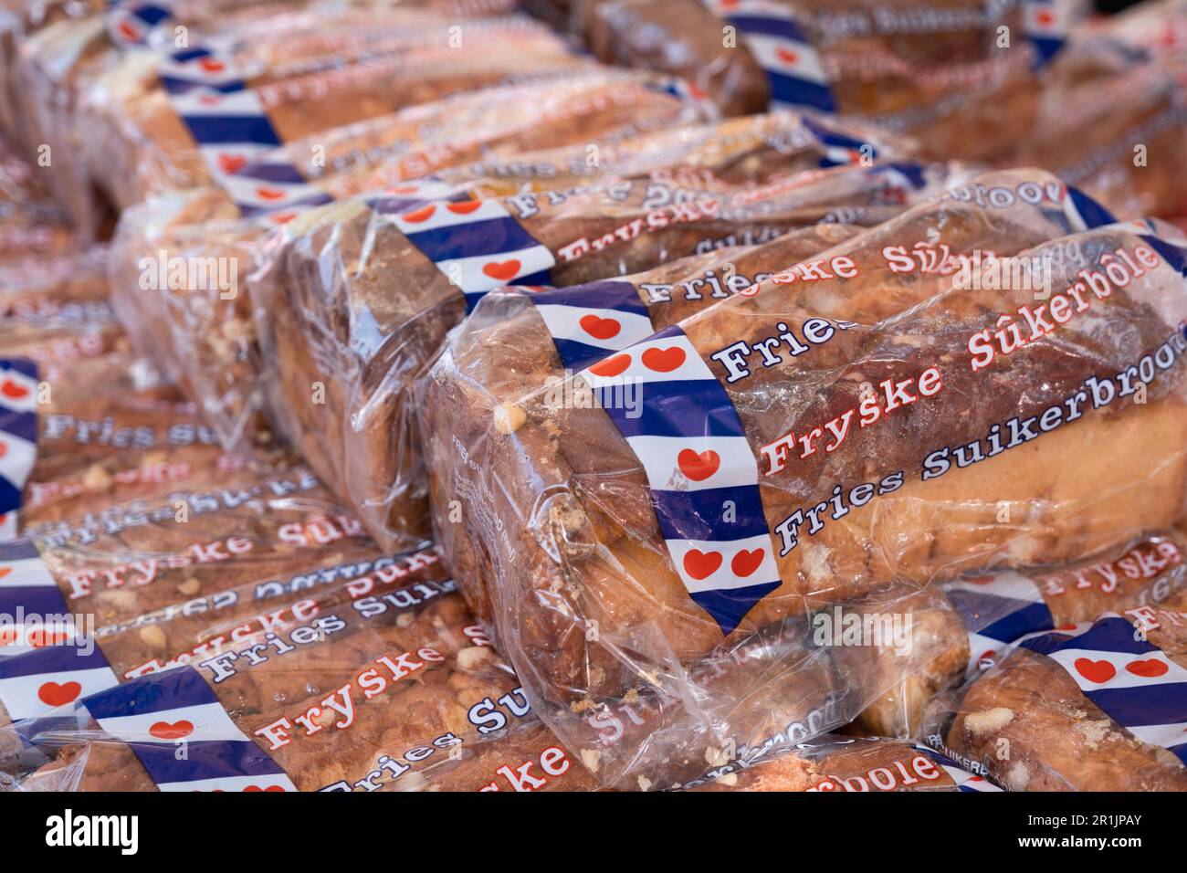 Traditional Dutch sugarbreads (Fryske Sukerbôlle) wrapped in plastic, for sale in a shop Stock Photo