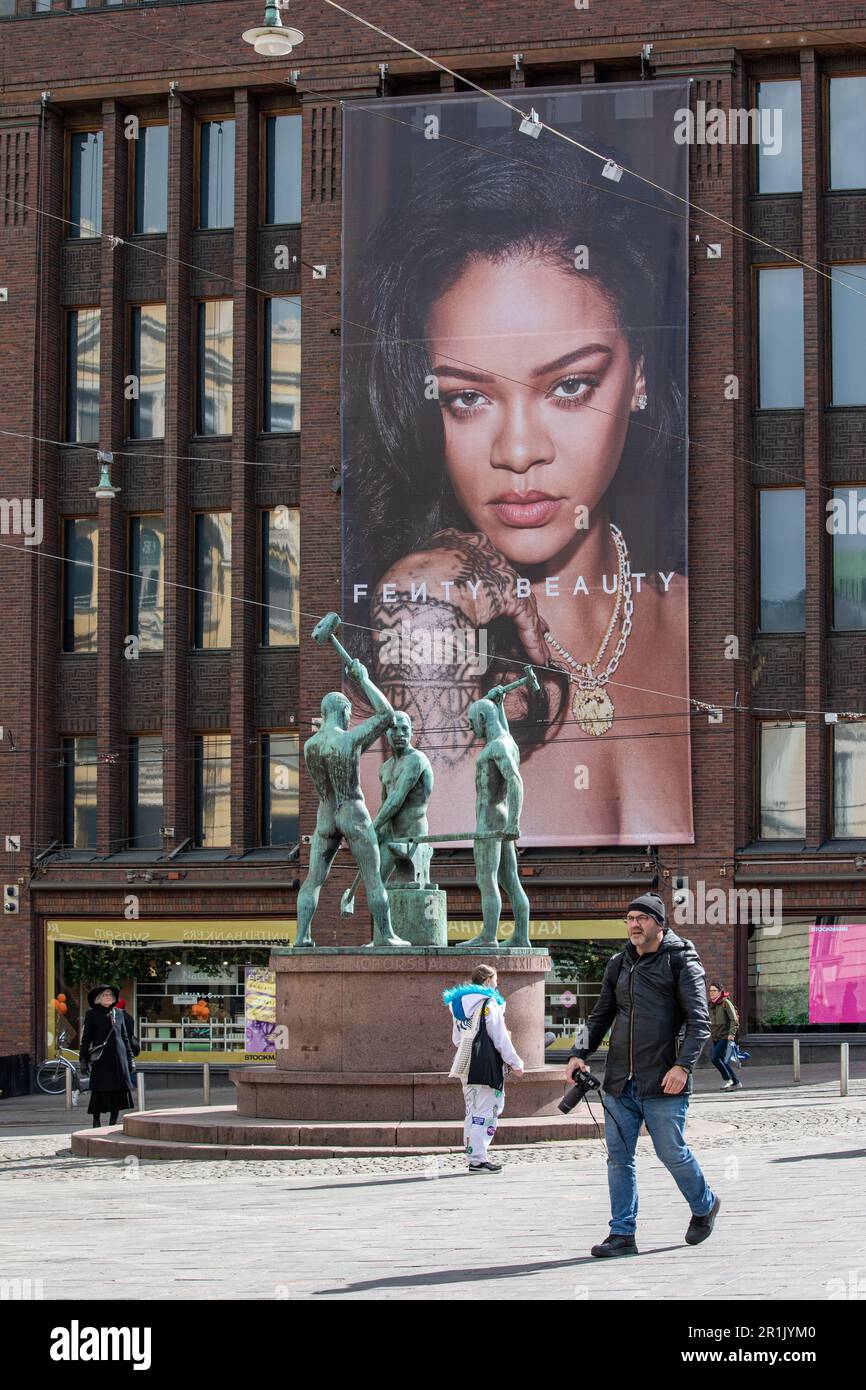Large banner advertising Fenty Beauty cosmetic brand with image of Rihanna on Stockmann department store wall in Helsinki, Finland Stock Photo