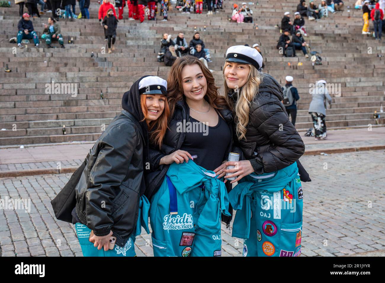 Female students wearing Faculty of Education student overalls at Senate Square on May Day Eve in Helsinki, Finland Stock Photo