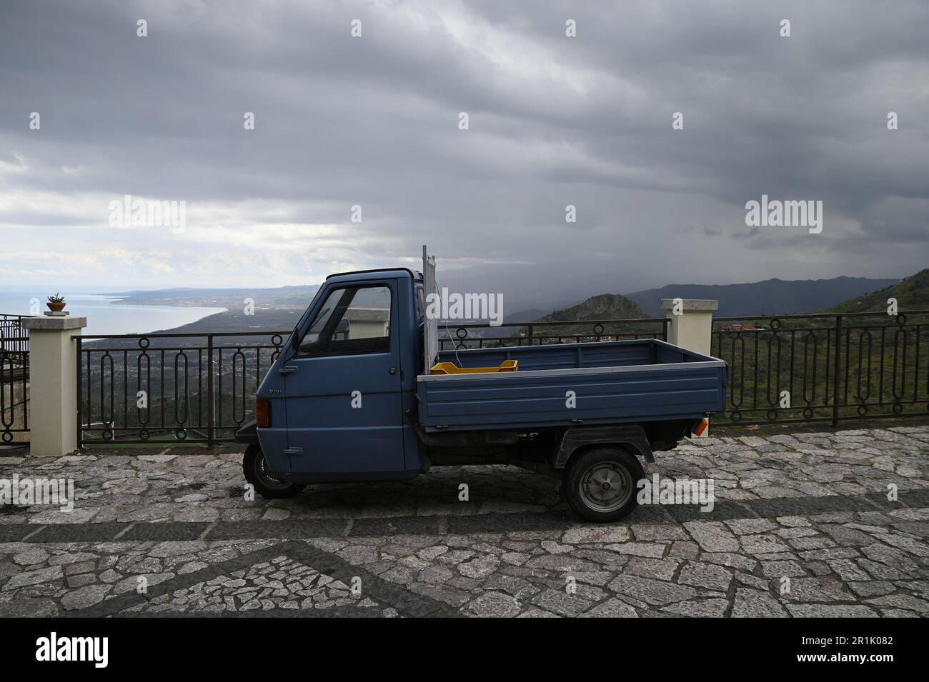 Antique three-wheeler utility truck in Castelmola Sicily, Italy. Stock Photo
