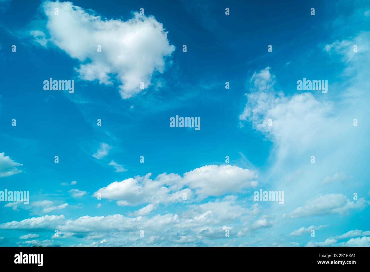 White fluffy clouds against blue sky in summer nature season weather ...