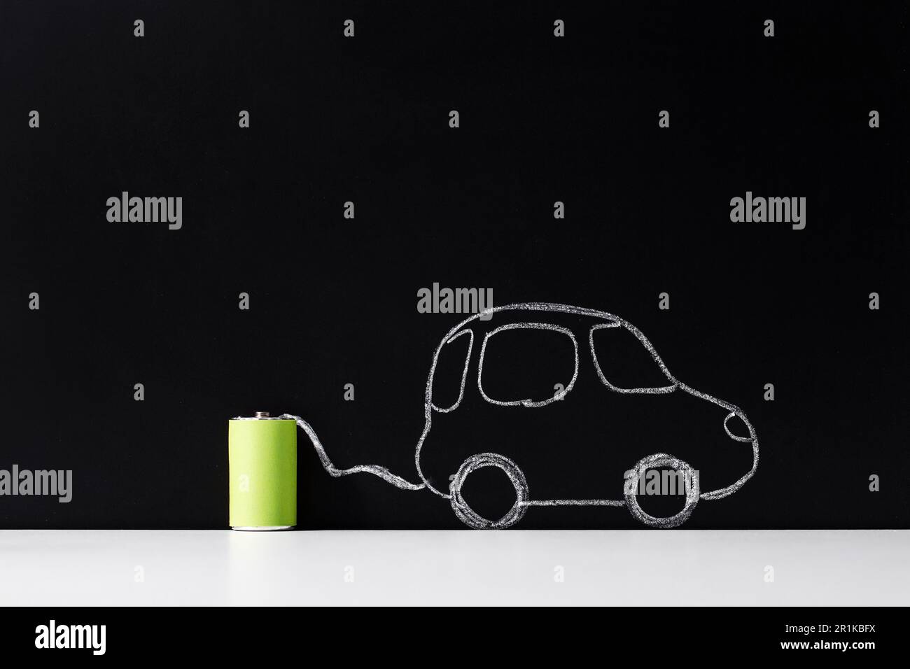 electric car charging from battery over black Stock Photo