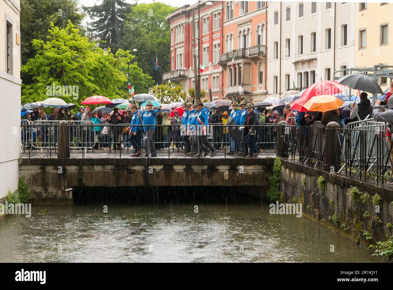 Udine, Italy (14th May 2023) - Alpini members marching under the rain during the final parade at the 2023 Alpini's annual meeting Stock Photo