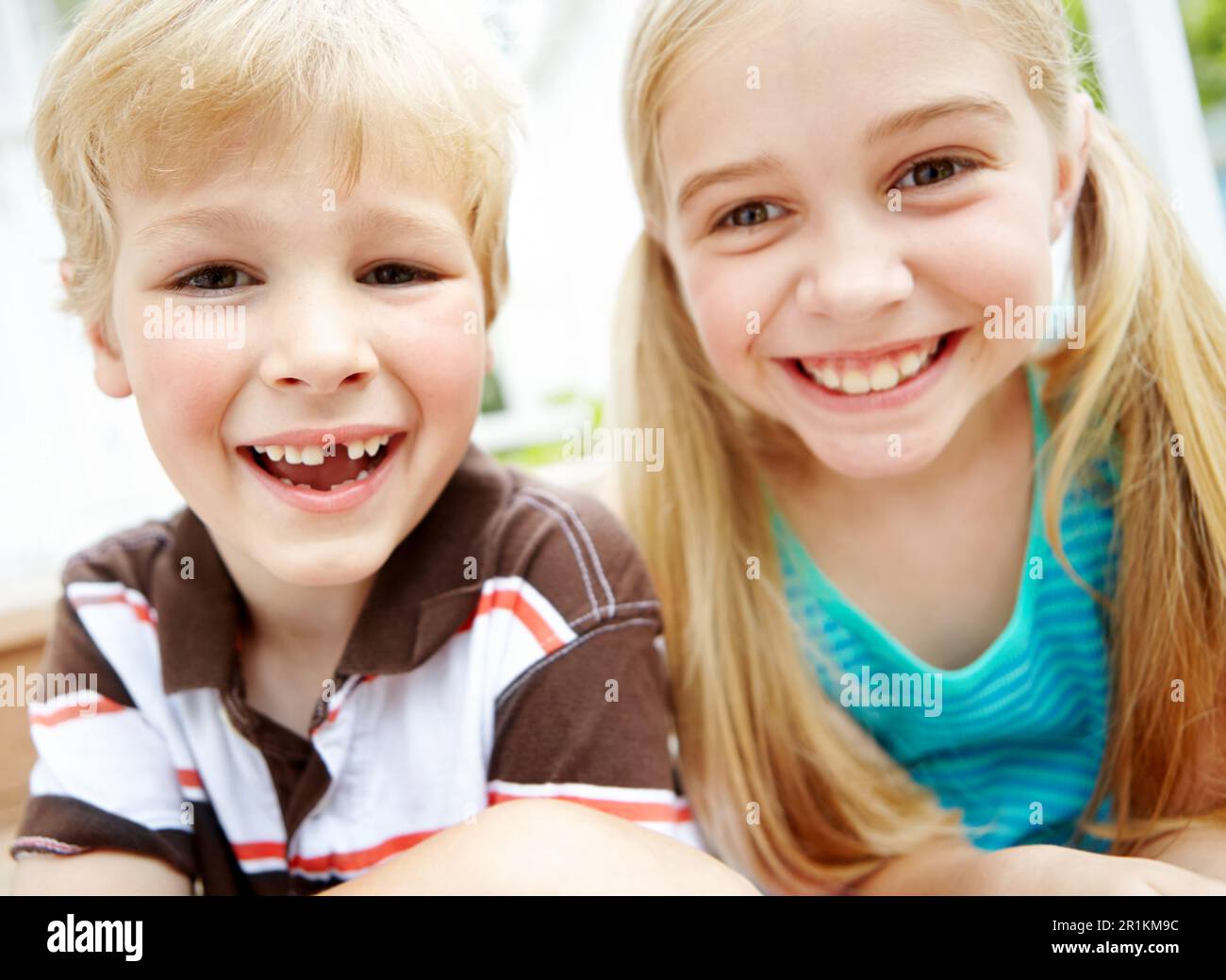 Siblings and best buddies. Two cute little children smiling and ...