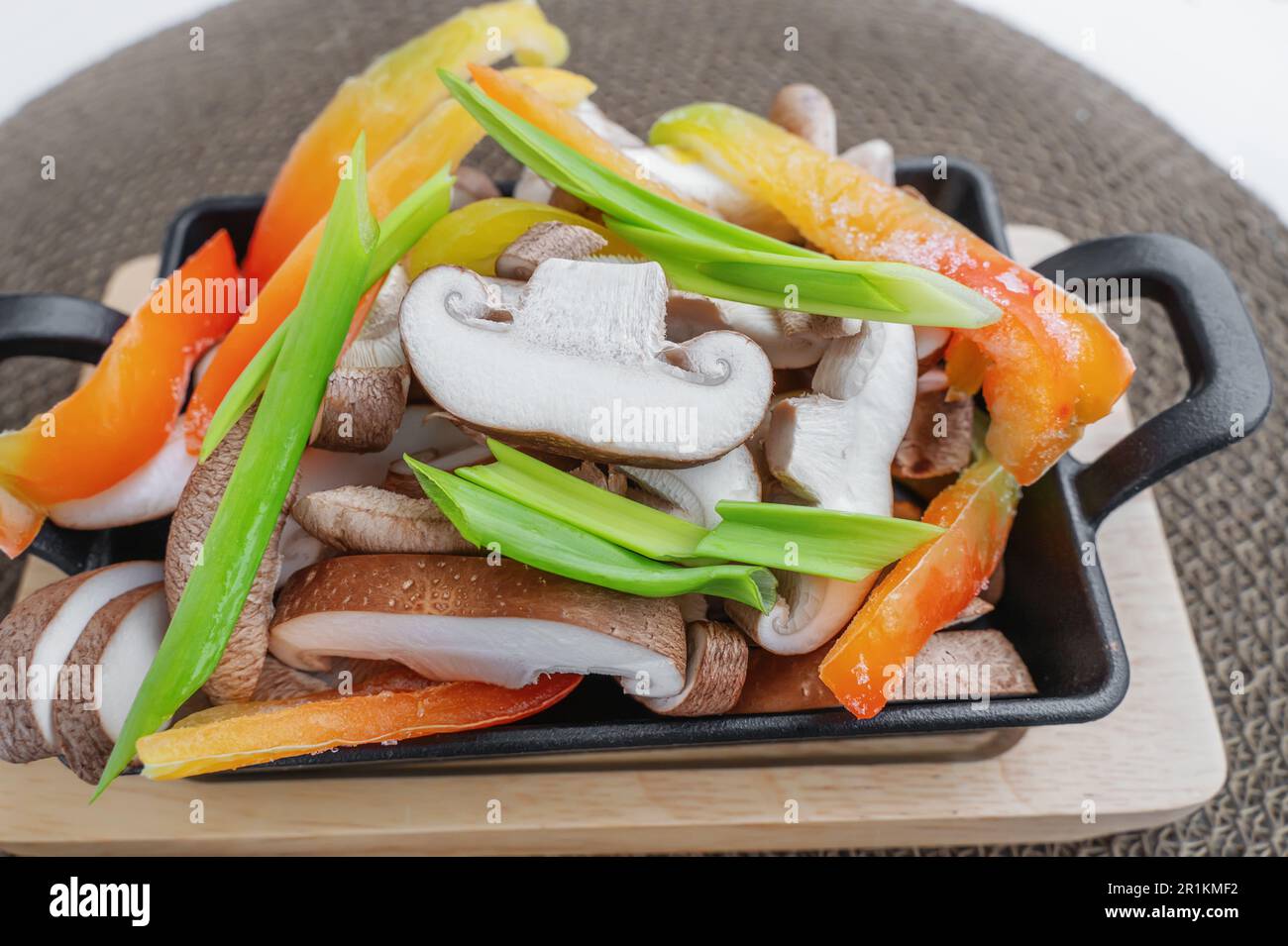 Shiitake mushrooms with frozen vegetables, bell peppers, onions and