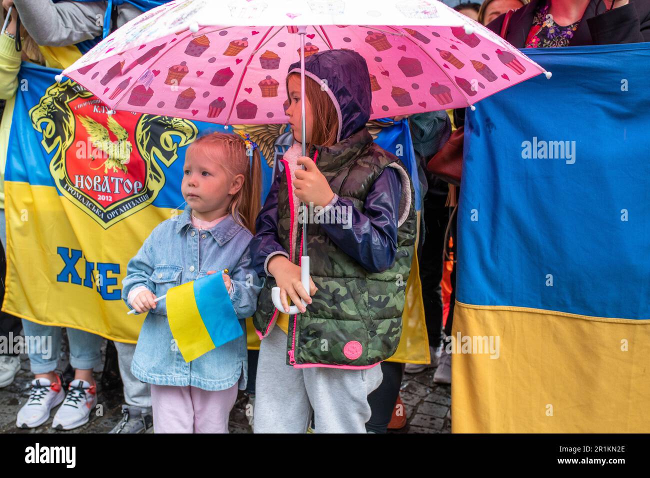Rome, Italy. 13th May, 2023. Two Ukrainian girls under an umbrella await President Zelensky's passage in Piazza Barberini on the occasion of the Ukrainian president's visit to Rome. Ukrainian President Volodymyr Zelensky visits Rome more than a year after the start of the conflict in Ukraine. After landing at Ciampino, he met with the Head of State, Sergio Mattarella, the Premier, Giorgia Meloni and, in the afternoon, Pope Francis. (Photo by Marcello Valeri/SOPA Images/Sipa USA) Credit: Sipa USA/Alamy Live News Stock Photo