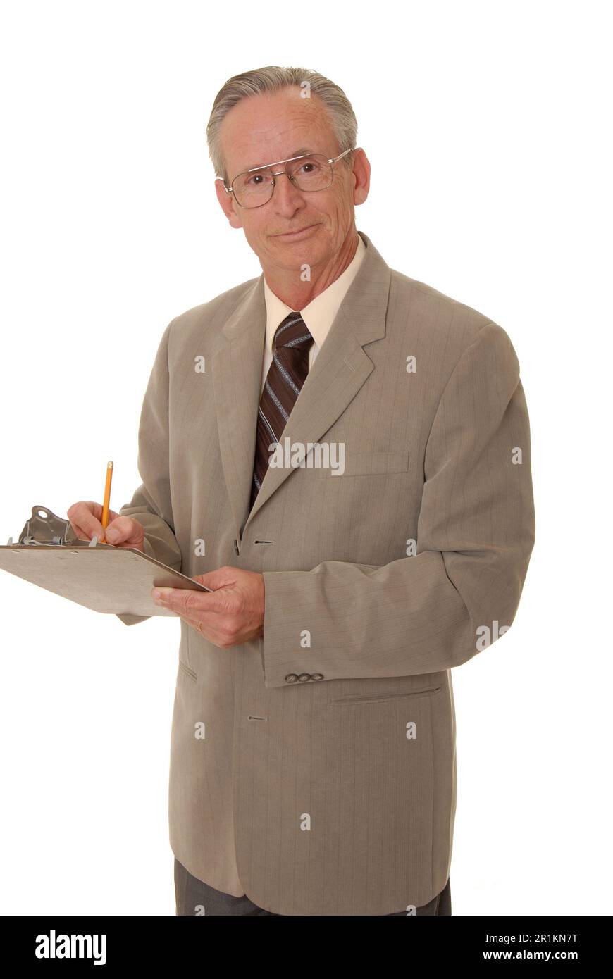 Senior businessman taking notes on a clipboard Stock Photo