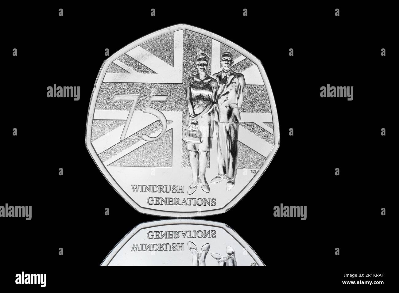 2023 50p issued with  the commemorative annual UK coin set featuring KIng Charles III. Reverse side commemorates 75 years of Windrush Generations Stock Photo
