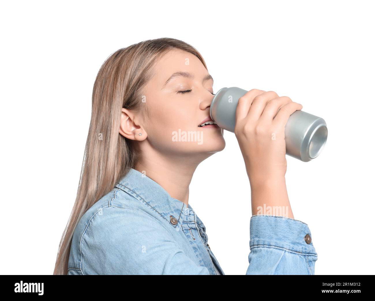 Beautiful woman drinking from beverage can on white background Stock Photo