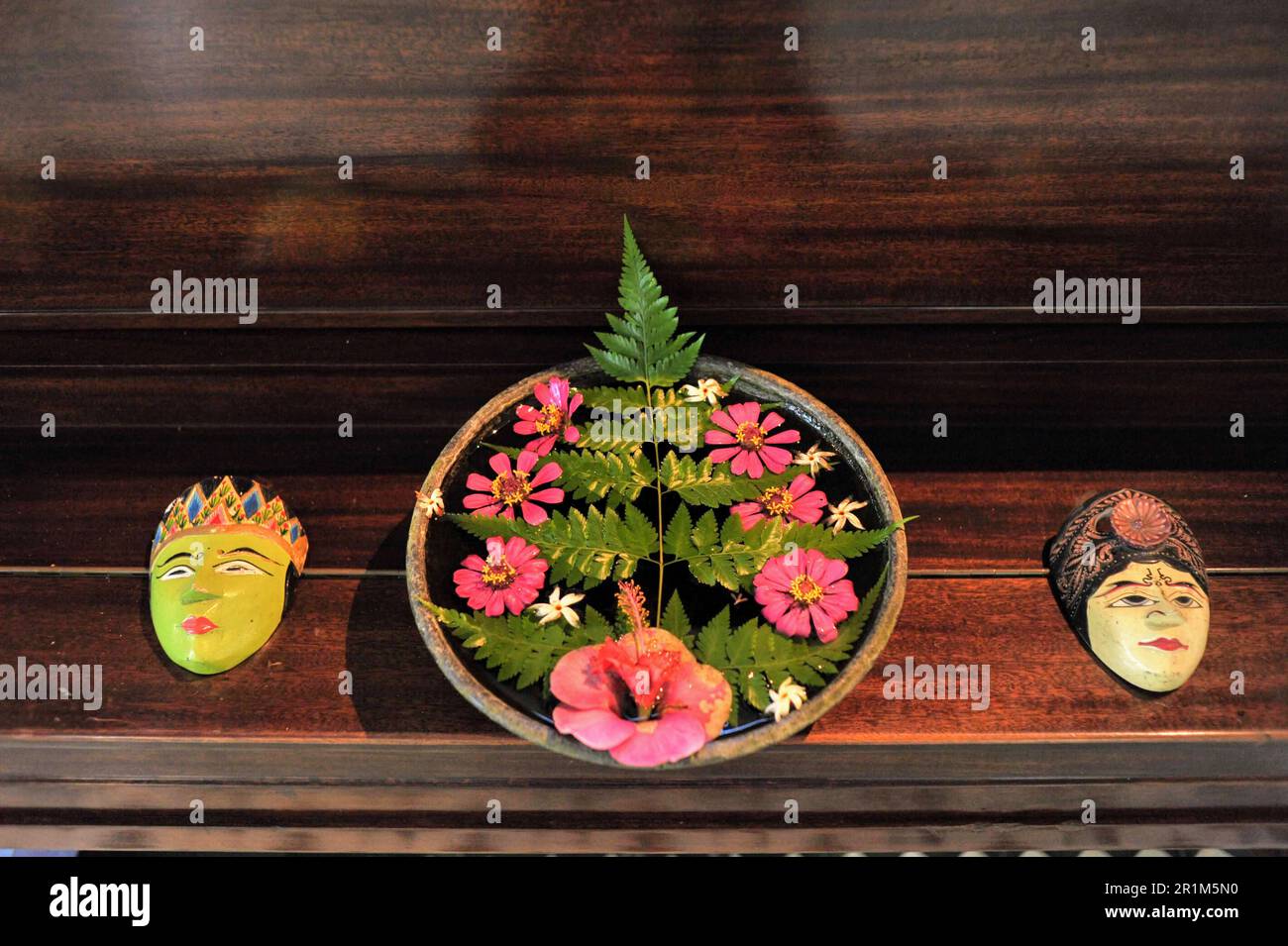 Javanese mask on wooden table Stock Photo
