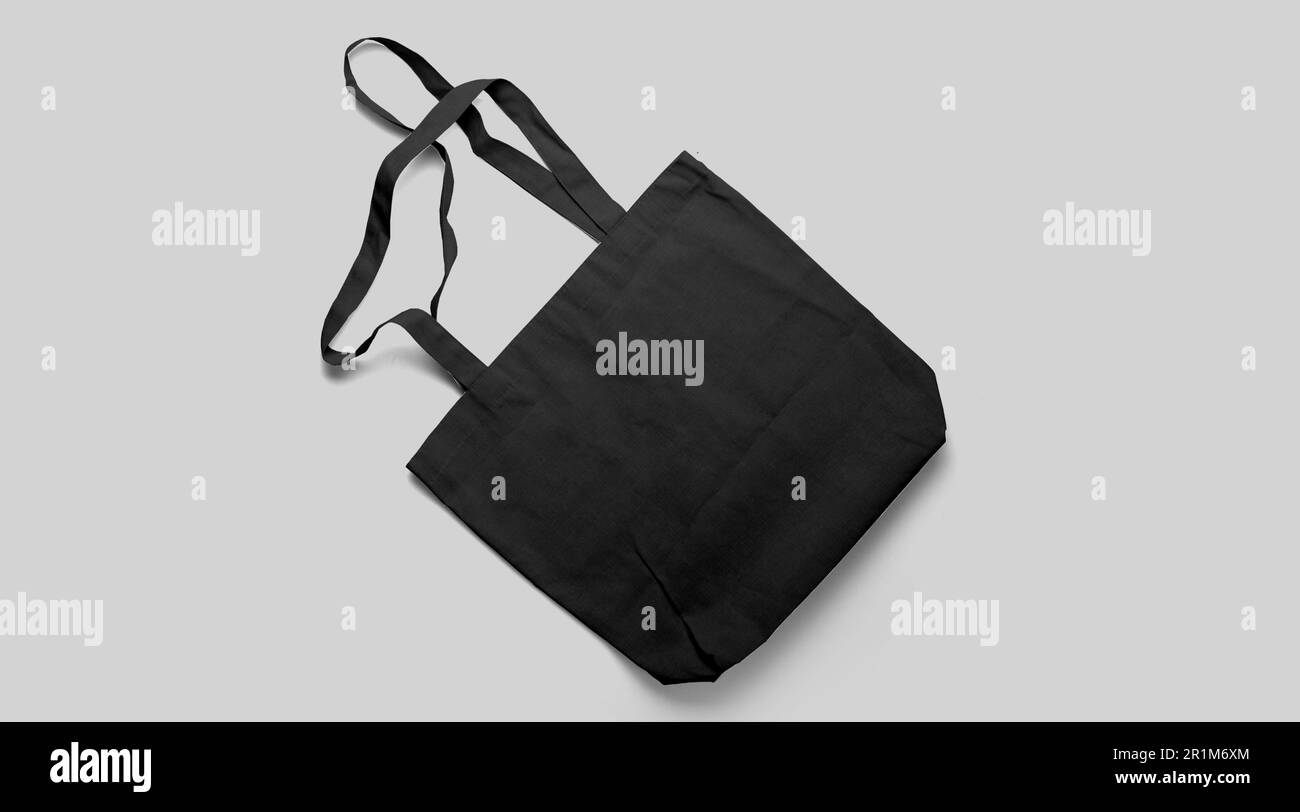 An isolated view of the black Tote bag on an grey background Stock
