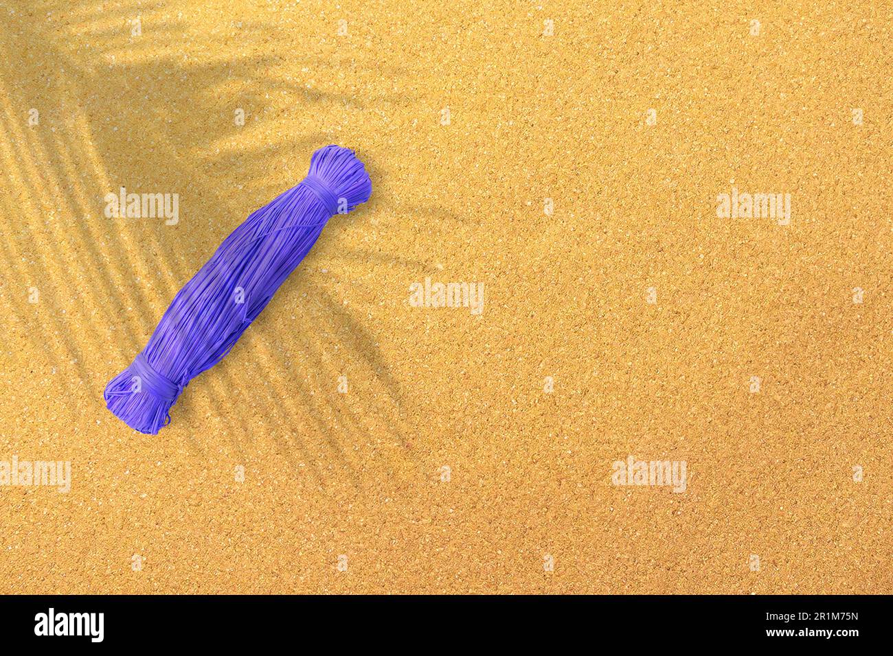 Top up view of blue ropes on sand beach. vacation concept background. Stock Photo