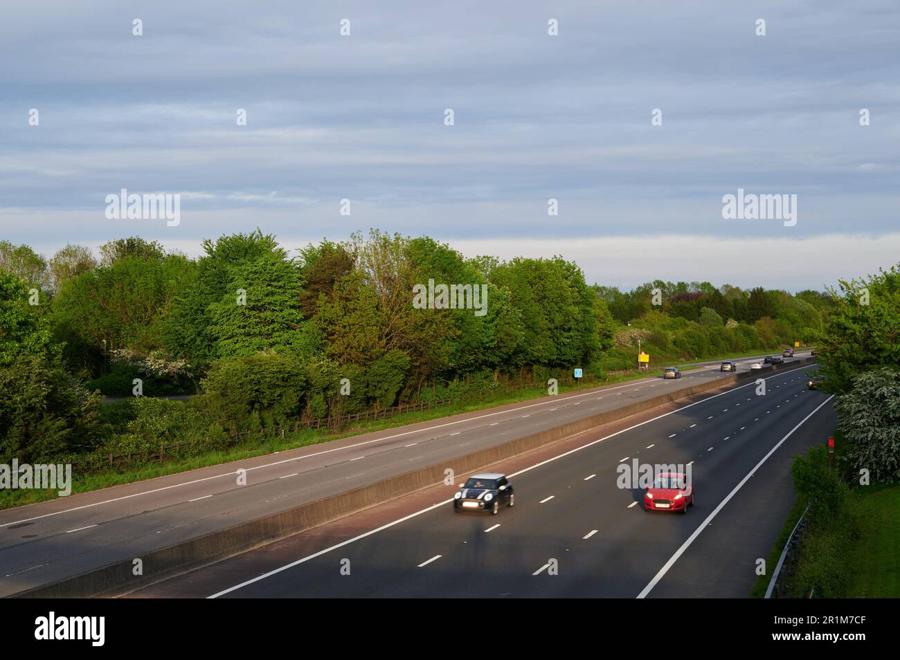 overhead image of three lane motorway in daylight with motion blur of traffic Stock Photo