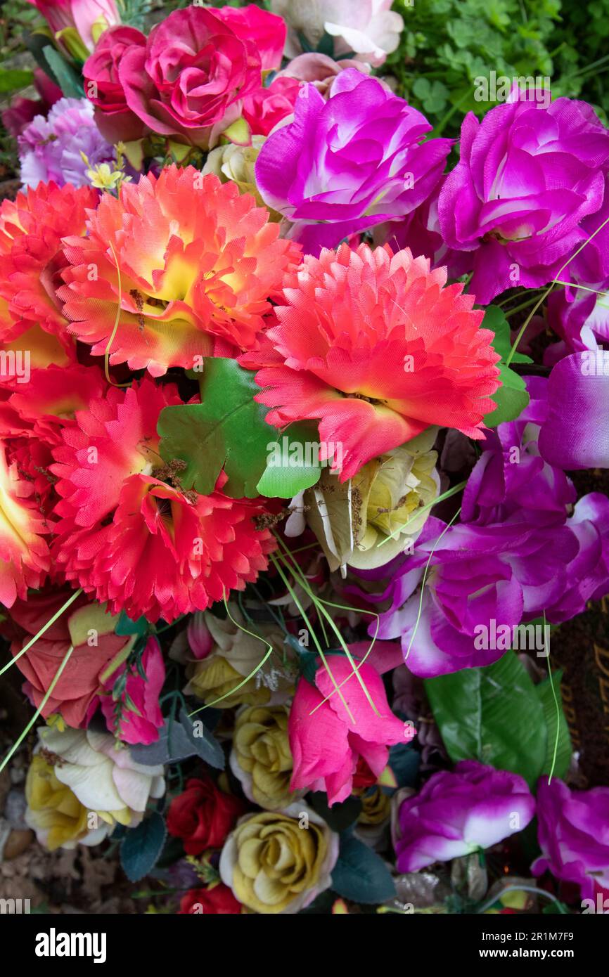 Artificial flowers on a grave in West Norwood Cemetery, one of London's