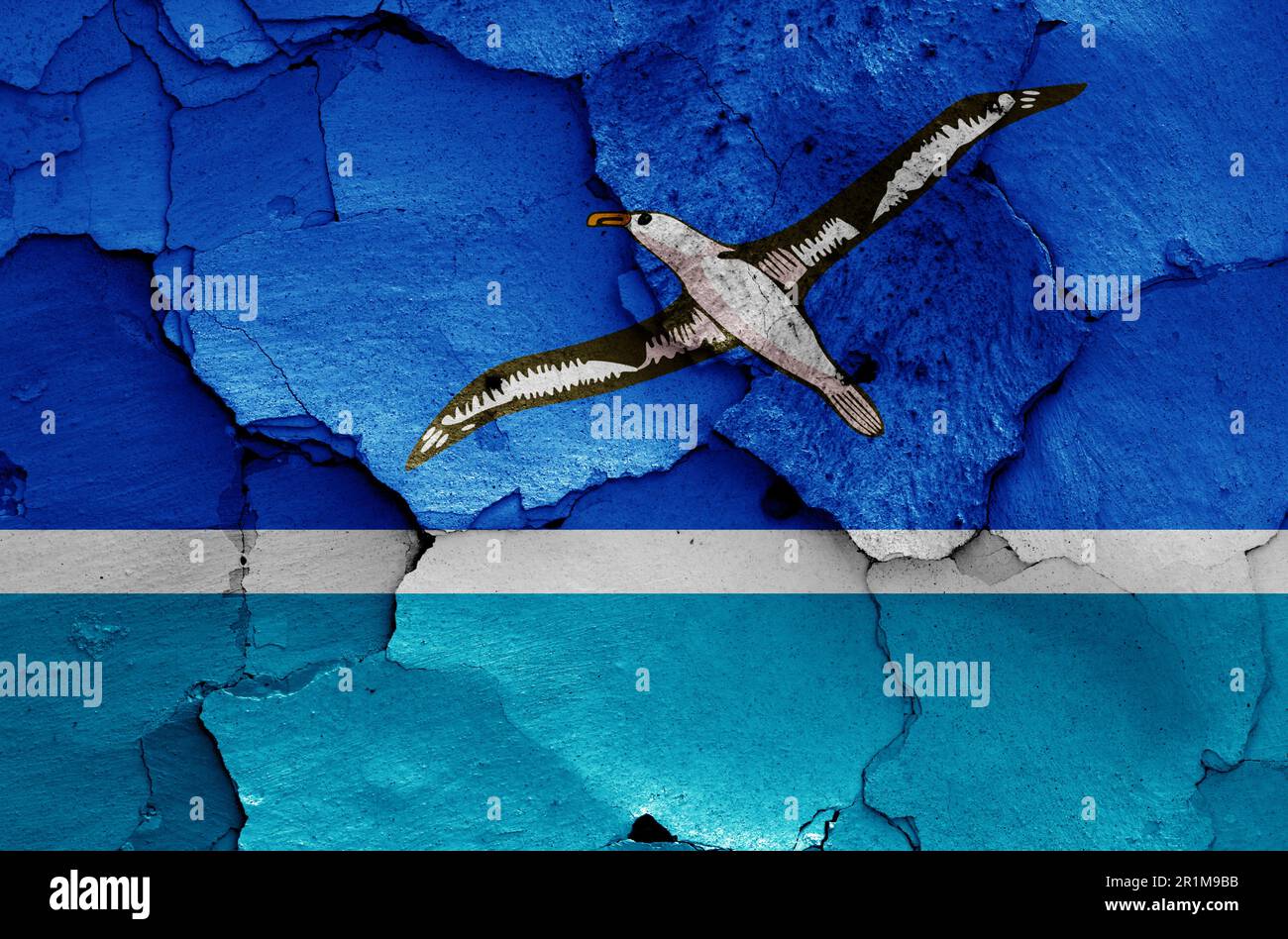 flag of Midway Atoll painted on cracked wall Stock Photo