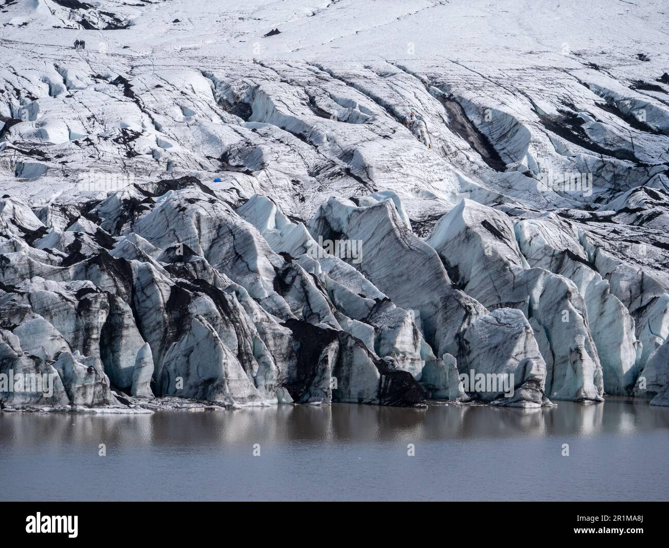 View of A breathtaking landscape featuring snow-capped mountains and a glacier ...