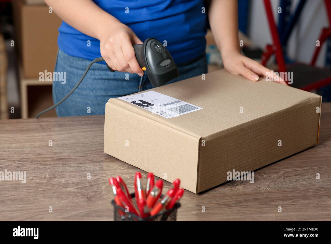 Woman scanner reading parcel hi-res stock photography and images - Alamy