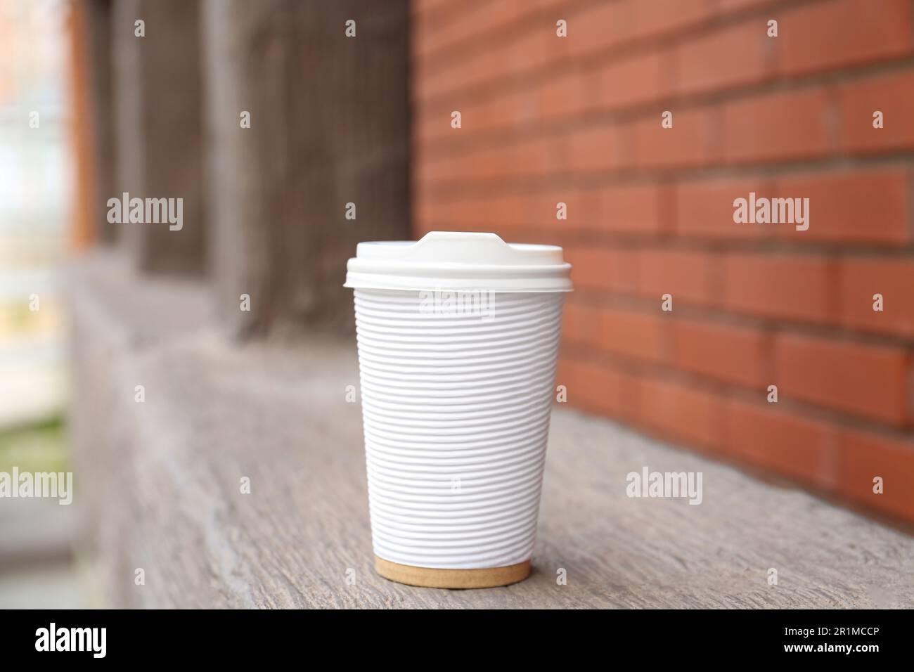 Paper cup of coffee outdoors. Takeaway drink Stock Photo - Alamy