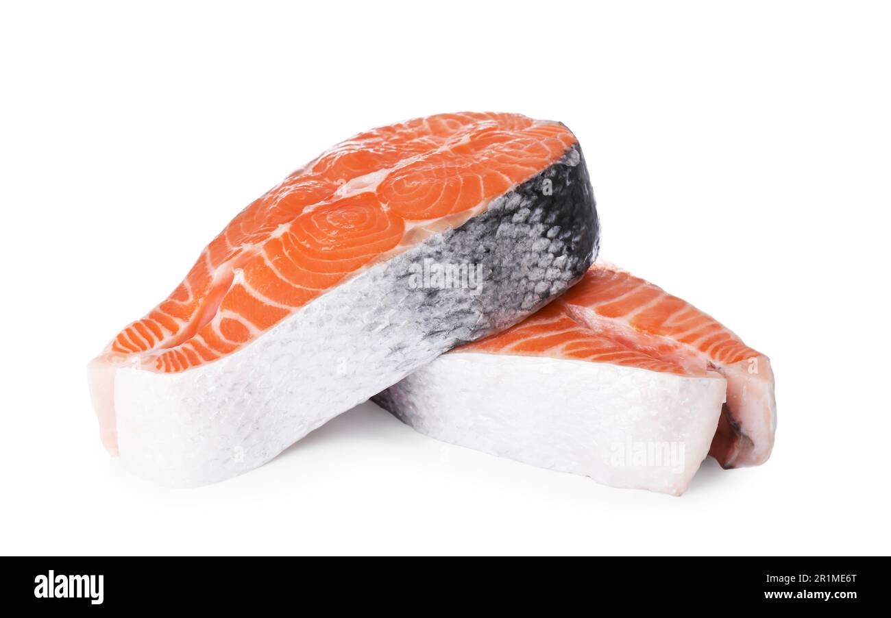 Fresh raw salmon steaks on white background Stock Photo - Alamy