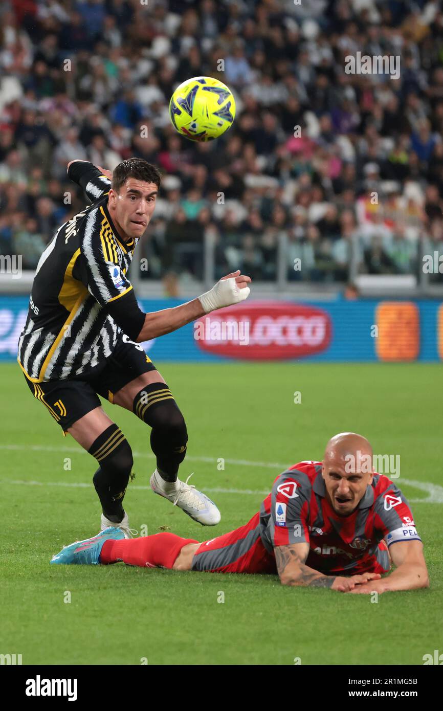 Turin, Italy. 14th May, 2023. Dusan Vlahovic of Juventus clashes with Vlad  Chiriches of US Cremonese during the Serie A match at Allianz Stadium,  Turin. Picture credit should read: Jonathan Moscrop/Sportimage Credit: