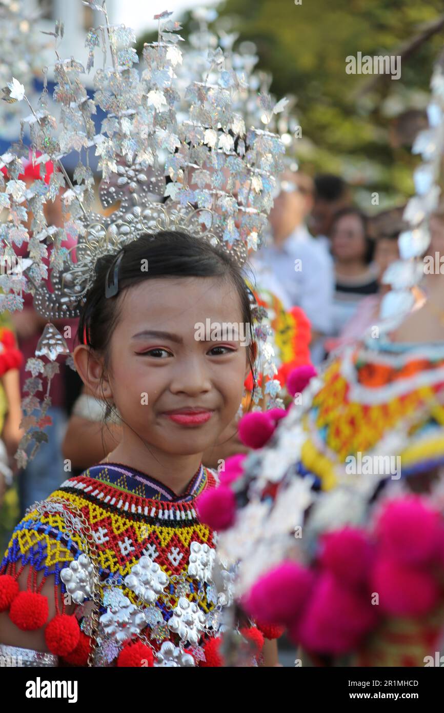 Iban lass with her Sugu Tinggi headdress at a parade in Kuching