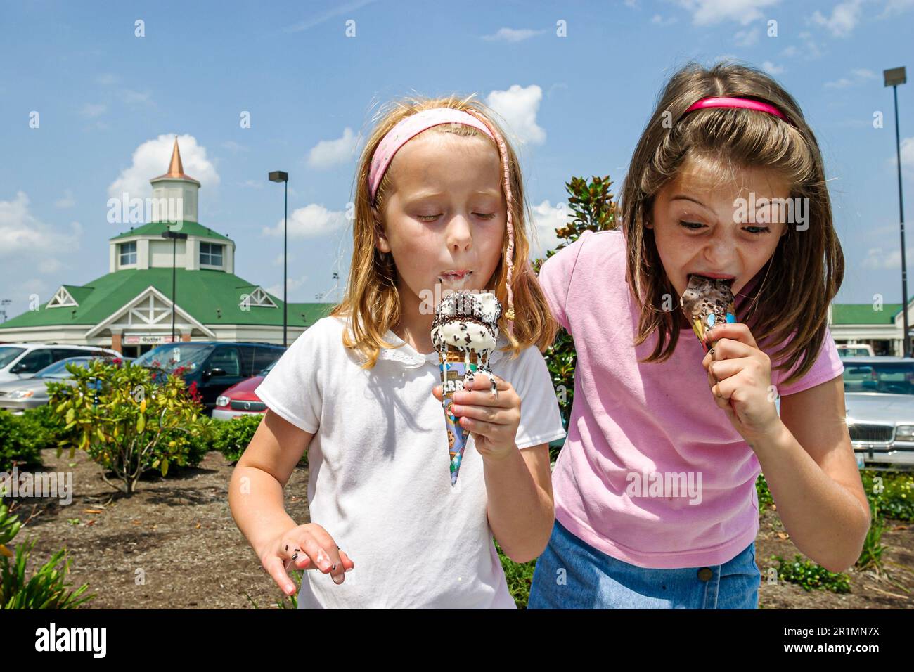 Sevierville Tennessee,Smoky Mountains,sisters eat ice cream at Tanger Outlet Mall,visitors travel traveling tour tourist tourism landmark landmarks cu Stock Photo