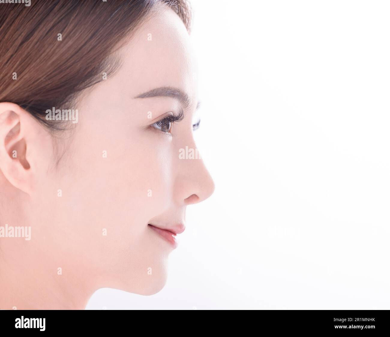 side view of  young asian woman with clean fresh skin on white background Stock Photo