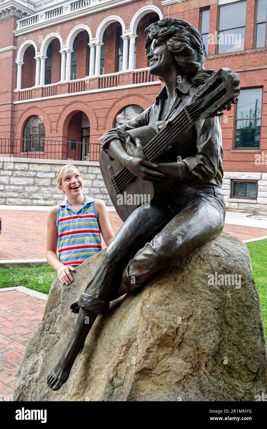 Tennessee Sevier County Courthouse Sevierville,Dolly Parton statue public art,girl admires admiring looks looking, Stock Photo