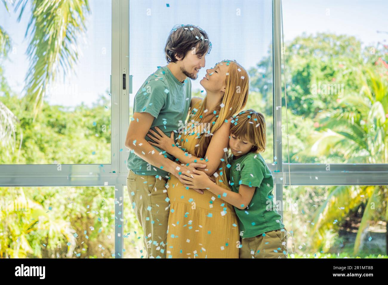 It's a boy. Expectant parents mother, father and their elder son are ...