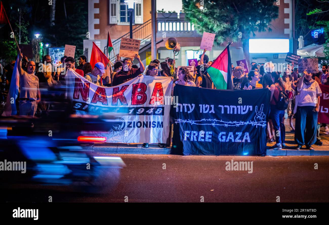 Tel Aviv, Israel. 10th May, 2023. Israeli protestors hold placards and Palestinian flags during an anti war demonstration. Israel and Islamic Jihad agreed to a ceasefire Saturday, after days of violence that have claimed the lives of at least 34 Palestinians and one Israeli. Credit: SOPA Images Limited/Alamy Live News Stock Photo