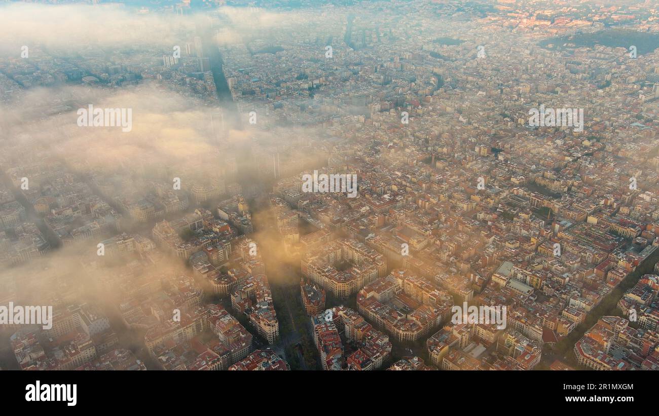 Aerial view of Barcelona City above the clouds and fog, typical ...