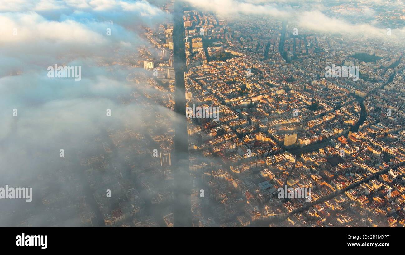 Aerial view of Barcelona City above the clouds and fog, typical ...