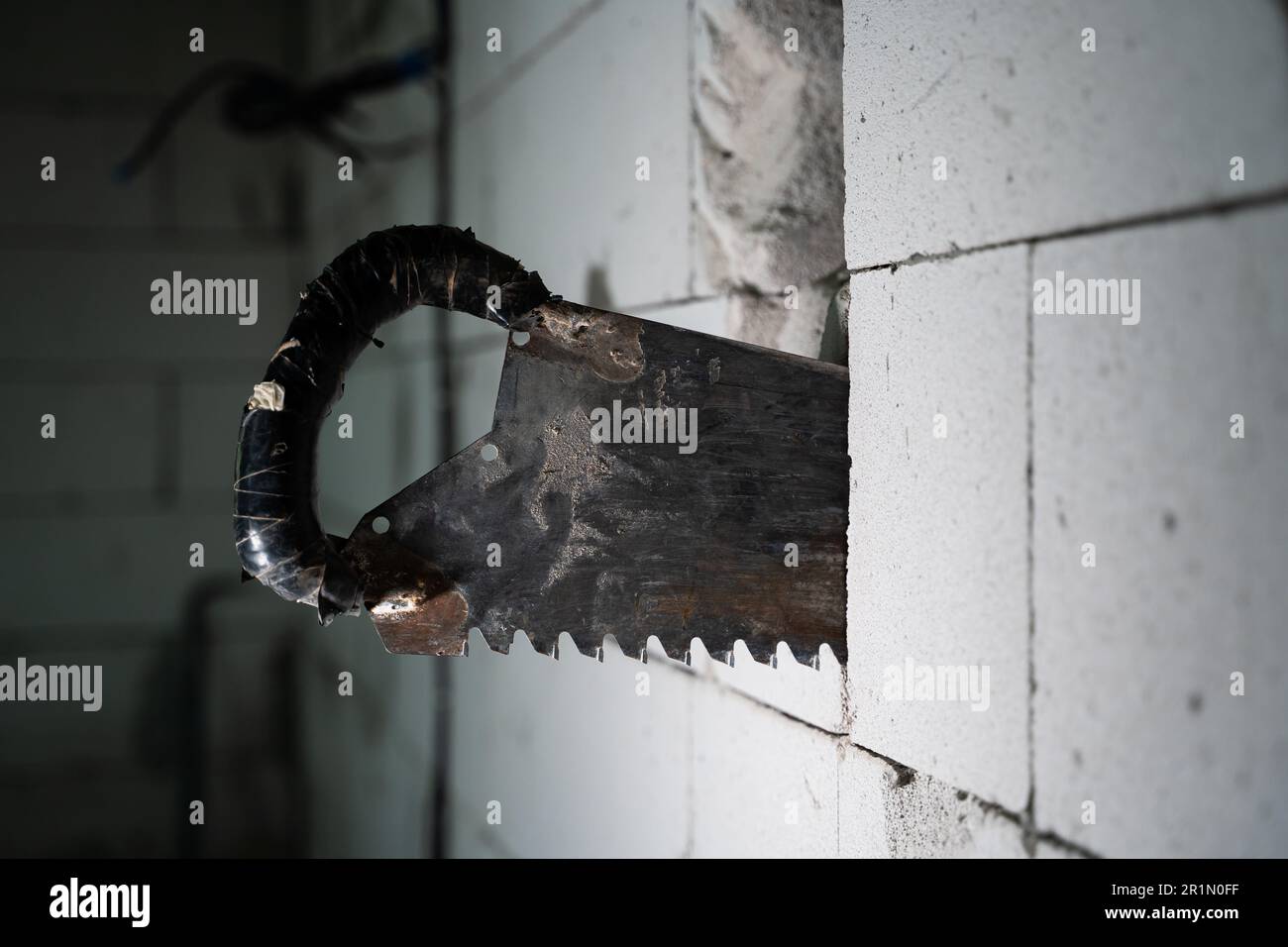 The process of cutting through a wall from an aerated concrete block ...