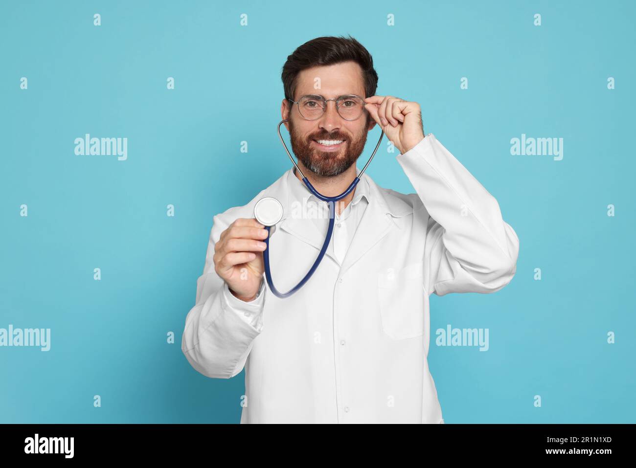 Bearded doctor in blue uniform hi-res stock photography and images - Alamy