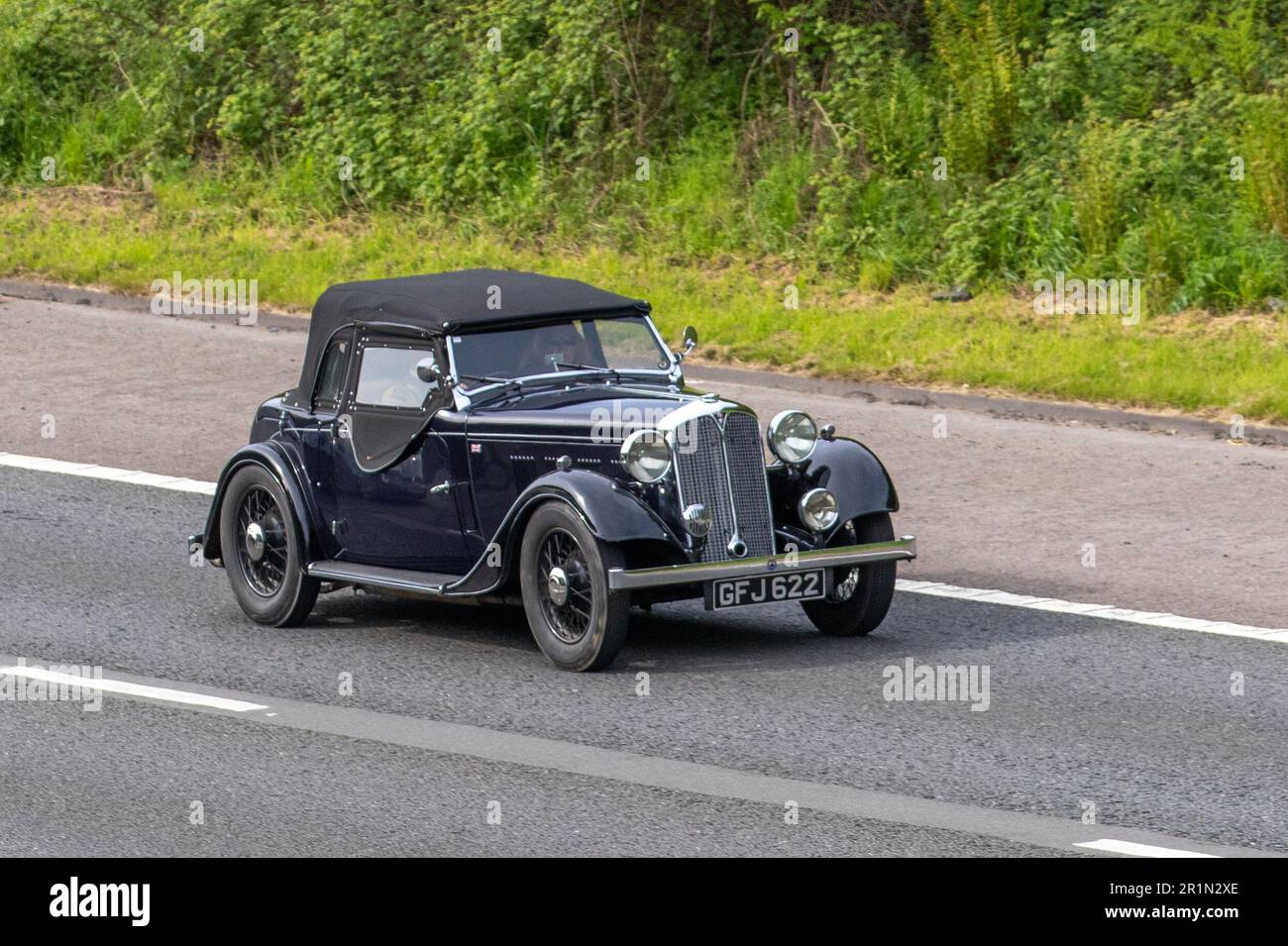 1935 Rover 12 Hp Petrol 1486 cc, Rover 10-12 was the fourth model Rover made; travelling on the M61 motorway UK Stock Photo