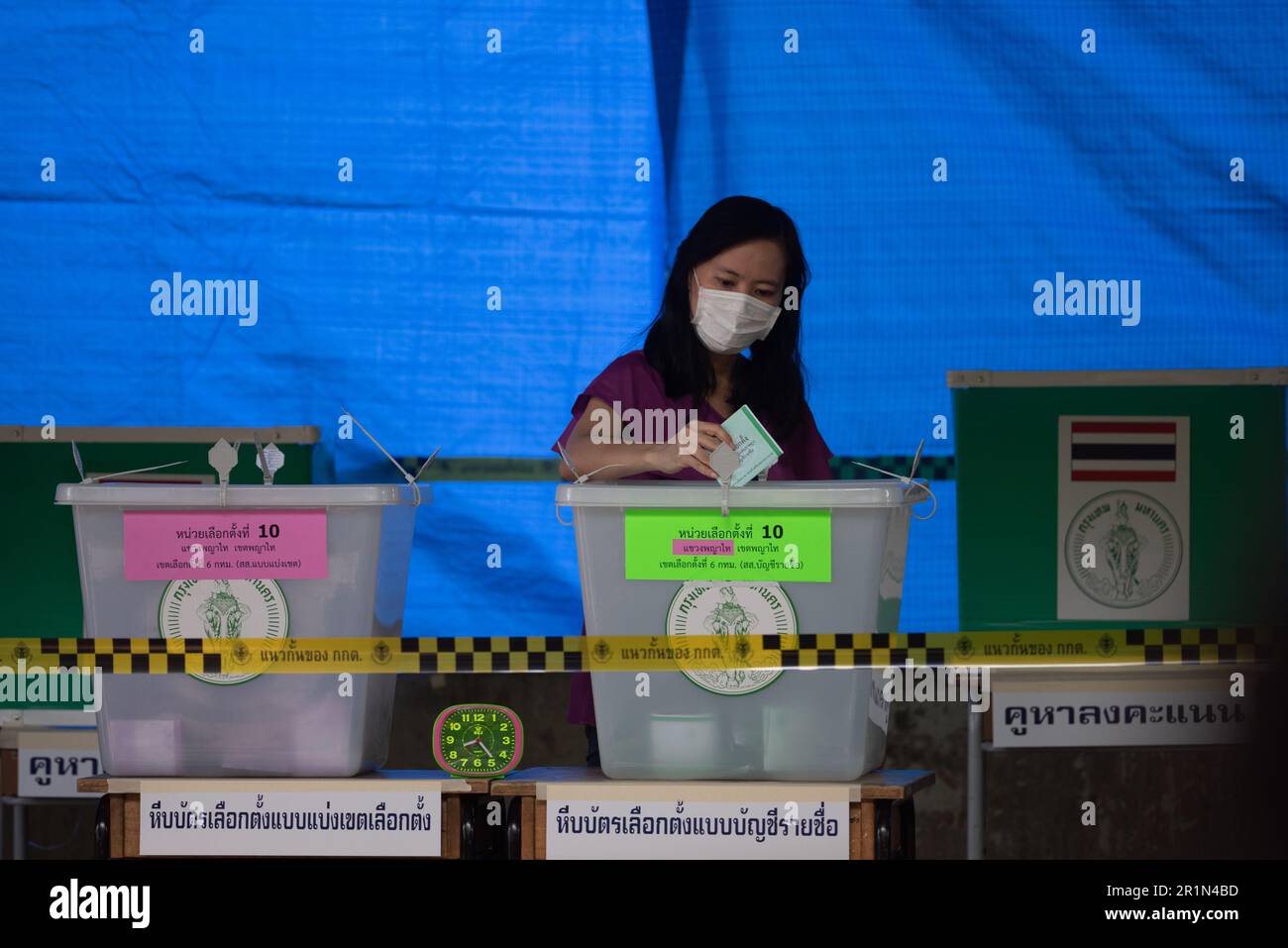 Bangkok, Thailand. 14th May, 2023. A woman casts his ballot during voting for general election at polling station in Bangkok on May 14, 2023. (Photo by Teera Noisakran/Pacific Press) Credit: Pacific Press Media Production Corp./Alamy Live News Stock Photo